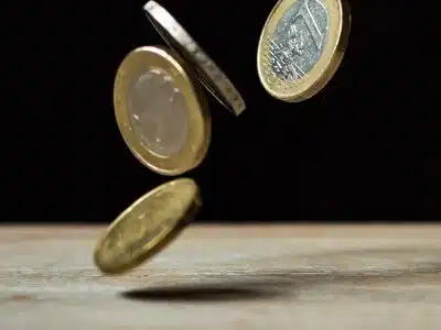 Coins on Brown Wood